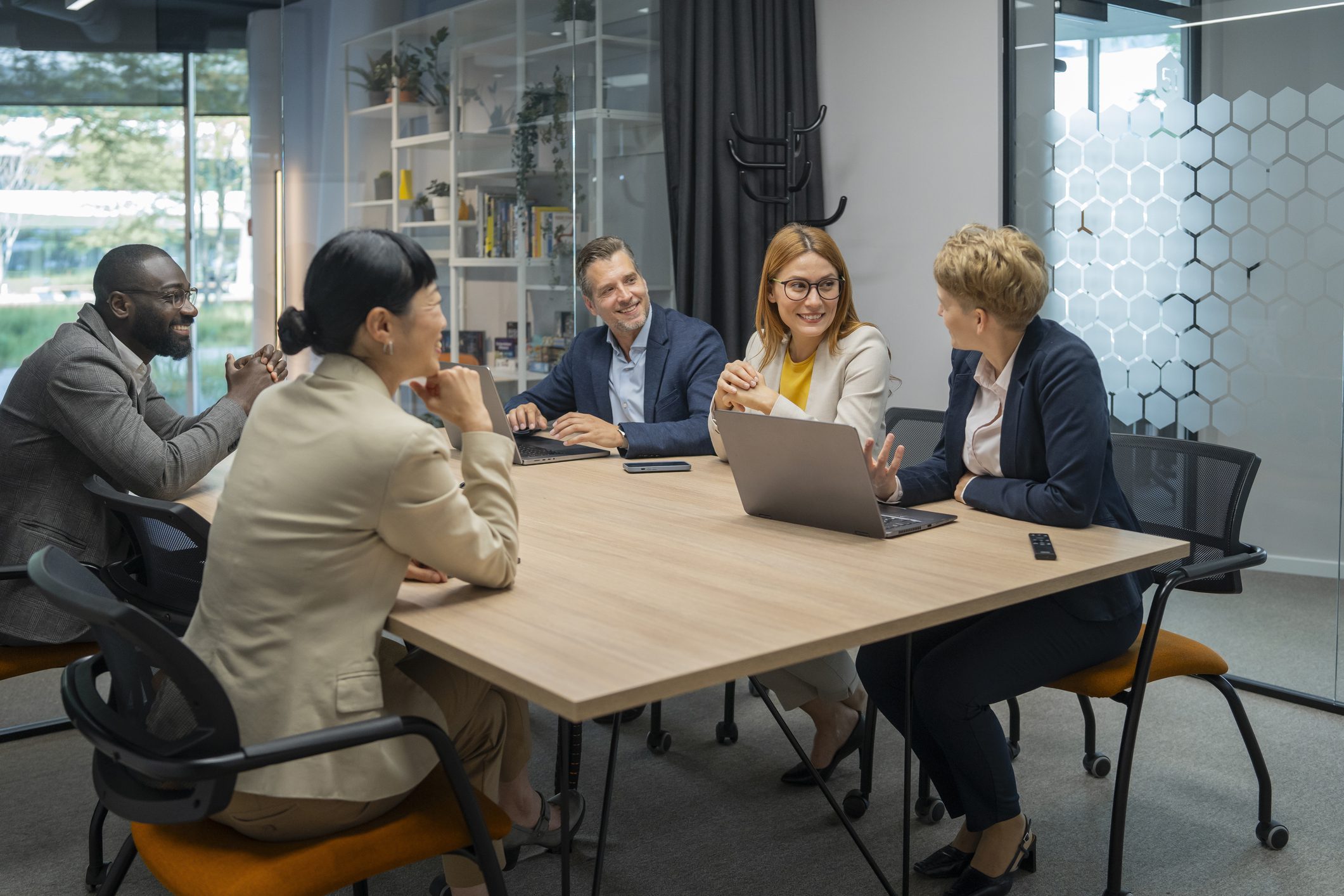 Office team meeting around conference table